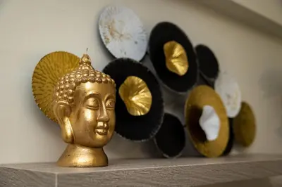 a gold statue sitting on a shelf with plates at Nobia 3 in Athens