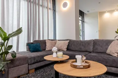 a living room with a couch and a table at Nobia 3 in Athens
