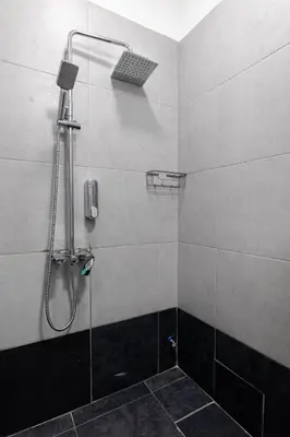 a bathroom with a shower with a glass door at Nobia 3 in Athens