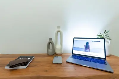 a laptop computer sitting on top of a wooden desk at Eliá Designer Suite - Terraza Lycabettus y Lujo en Mesogeion in Athens