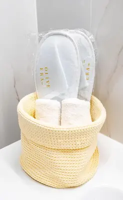 a basket filled with toilet paper on a counter at Eliá Designer Suite - Terraza Lycabettus y Lujo en Mesogeion in Athens