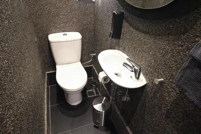 a bathroom with a toilet and a sink at Apollo & Nike 1952-2025 in Athens