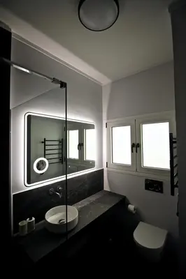 a bathroom with a sink and a mirror at Apollo & Nike 1952-2025 in Athens