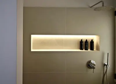 a bathroom with a shower with a light on the wall at Apollo & Nike 1952-2025 in Athens