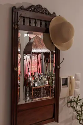 a mirror with a gazebo with bottles in it at Seaside Grey Pearl Villa in Piraeus