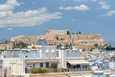 a view of the acropolis from the roof of a building at Chic 1-Bedroom Apartment with balcony by WeHost Athens in Athens