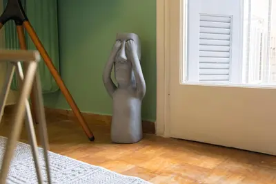 a statue of a woman with her head in a room at Whispering Walls Premium 1 bedroom Apartment in Athens