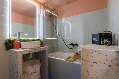 a bathroom with a sink and a bath tub at Whispering Walls Premium 1 bedroom Apartment in Athens