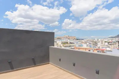 a balcony with a view of a city at Bright 1-Bedroom Apartment by WeHost Athens in Athens