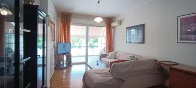 a living room with a couch and a tv at Down Town Flat Apartment in Athens