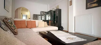 a living room with a couch and a coffee table at Down Town Flat Apartment in Athens
