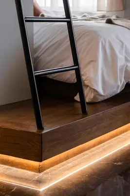a bed with a metal ladder on top of a wooden floor at Chic Urban Suite - Parthenon Viewpoint in Athens