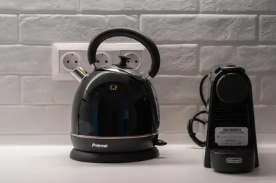 a tea kettle and a phone on a counter at Chic Urban Suite - Parthenon Viewpoint in Athens