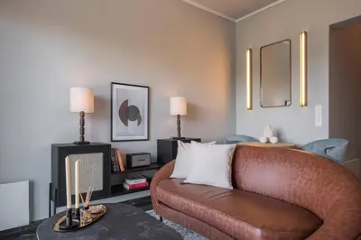 a living room with a couch and a table at Chic Urban Suite - Parthenon Viewpoint in Athens