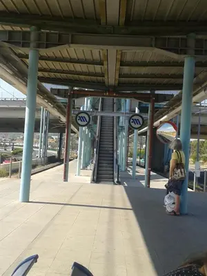 a woman standing at a train station at Near the Airport & near the Metro and Suburban station