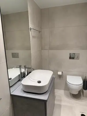 a bathroom with a sink and a toilet at AMG Superior Central Apartment sleeps up to 5 in Athens