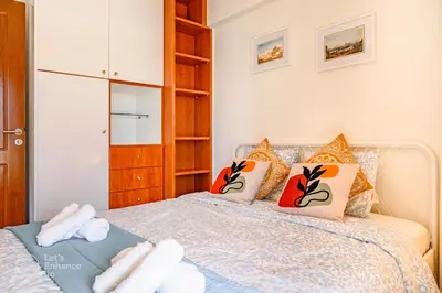 a bedroom with a bed with towels on it at Lovehome - 4BD Villa with views-15mins to airport,10mins to MEC ΑΕ- 2mins to bus stop ,10mins to Suburban Railway on foot in Athens