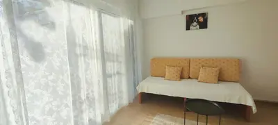 a bedroom with a bed and a window at Zen Apartment in Athens