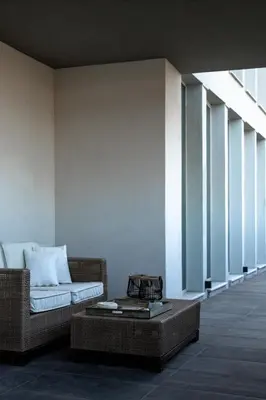a living room with a couch and a coffee table at Horizon Luxury Seafront Villa in Vaia