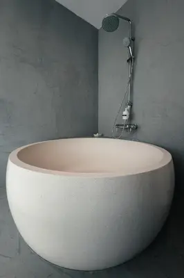 a white bath tub in a bathroom with a shower at Horizon Luxury Seafront Villa in Vaia