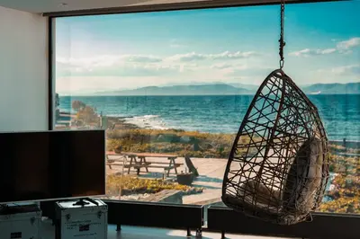 a room with a large view of the ocean at Horizon Luxury Seafront Villa in Vaia