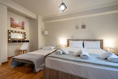 a bedroom with two beds with towels on them at Downtown Kolonaki Getaway - 1BR Apartment by ΜΡS in Athens