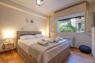 a bedroom with a large bed with towels on it at Downtown Kolonaki Getaway - 1BR Apartment by ΜΡS in Athens