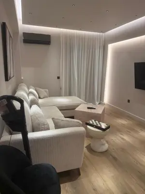 a living room with a couch and a table at Πολυτελής απόδραση στην Γλυφάδα in Athens