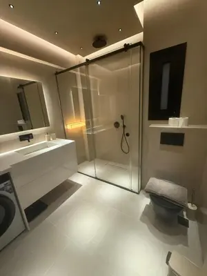 a bathroom with a shower and a toilet and a sink at Πολυτελής απόδραση στην Γλυφάδα in Athens
