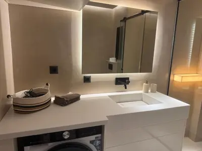 a white bathroom with a sink and a mirror at Πολυτελής απόδραση στην Γλυφάδα in Athens