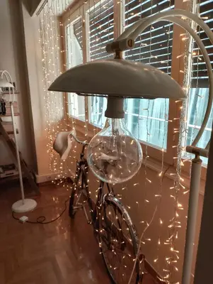 a lamp with a bicycle with lights on it at La Boheme stylish Flat i in Athens