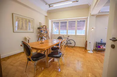 a dining room with a wooden table and chairs at La Boheme stylish Flat i in Athens