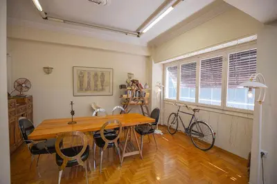 a dining room with a wooden table and chairs at La Boheme stylish Flat i in Athens