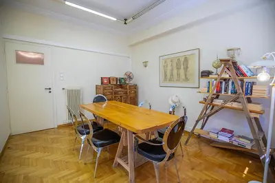 a dining room with a wooden table and chairs at La Boheme stylish Flat i in Athens