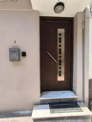a wooden door on the side of a building at The Argy Apartment in Athens
