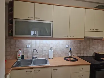 a kitchen with a sink and a microwave at The Argy Apartment in Athens