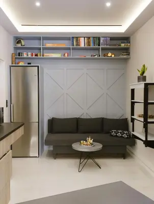 a living room with a couch and a table at Viorelia's Home in Athens