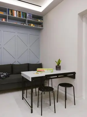 a living room with a table and a couch at Viorelia's Home in Athens