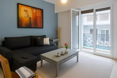 a living room with a couch and a coffee table at Lovingly apartment Galatsi 1 in Athens
