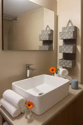 a bathroom with a white sink and a mirror at Lovingly apartment Galatsi 1 in Athens