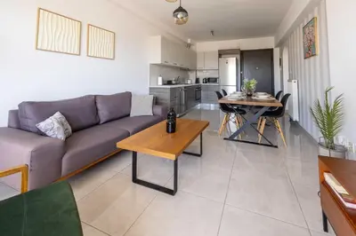 a living room with a couch and a table at Modern Stay near Piraeus Port E3 in Piraeus