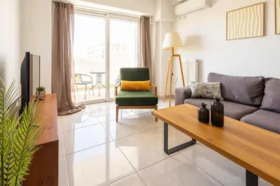 a living room with a couch and a table at Modern Stay near Piraeus Port E3 in Piraeus