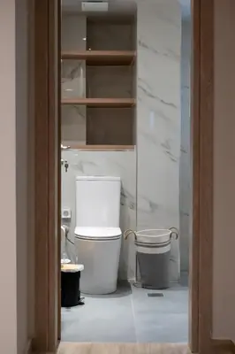 a bathroom with a white toilet in a room at Pop Art Apartment in Piraeus in Piraeus