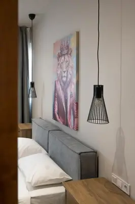 a bedroom with a painting of a lion with a crown at Pop Art Apartment in Piraeus in Piraeus