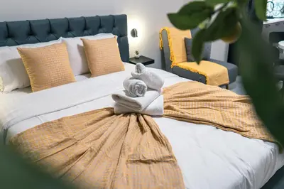 a bedroom with a bed with a towel on it at Urban Nest in Trendy Koukaki in Athens