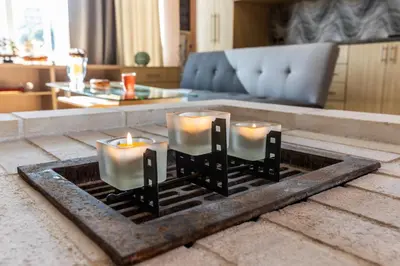 a group of candles on a table in a living room at Michele Studio in Artemida