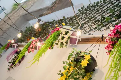 a bunch of flowers in pots on a table at Sani Suite 7 in Athens