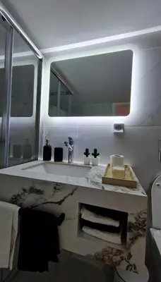 a bathroom with a sink and a mirror at Cozy apartment in Athens in Athens