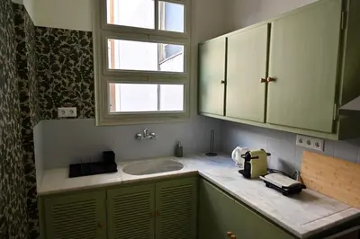 a bathroom with a sink and a window at Brand New! Vintage Charm, Modern Comfort in Athens