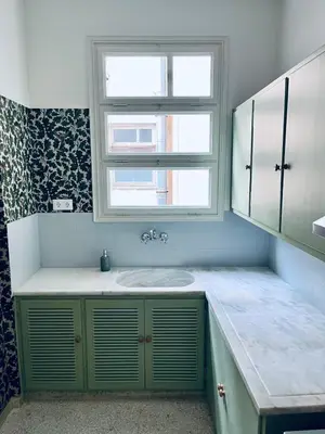 a bathroom with a sink and a window at Brand New! Vintage Charm, Modern Comfort in Athens